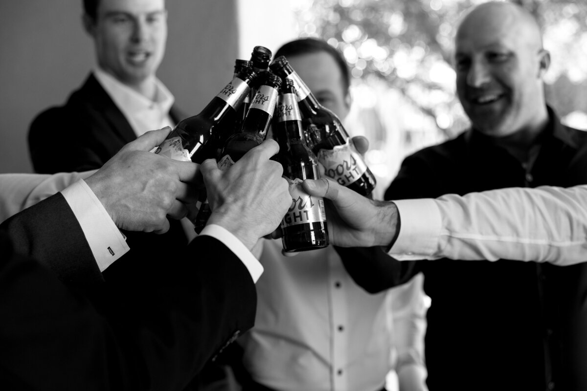 Groom and groomsmen cheering on wedding day at the Omni in Scottsdale, Arizona