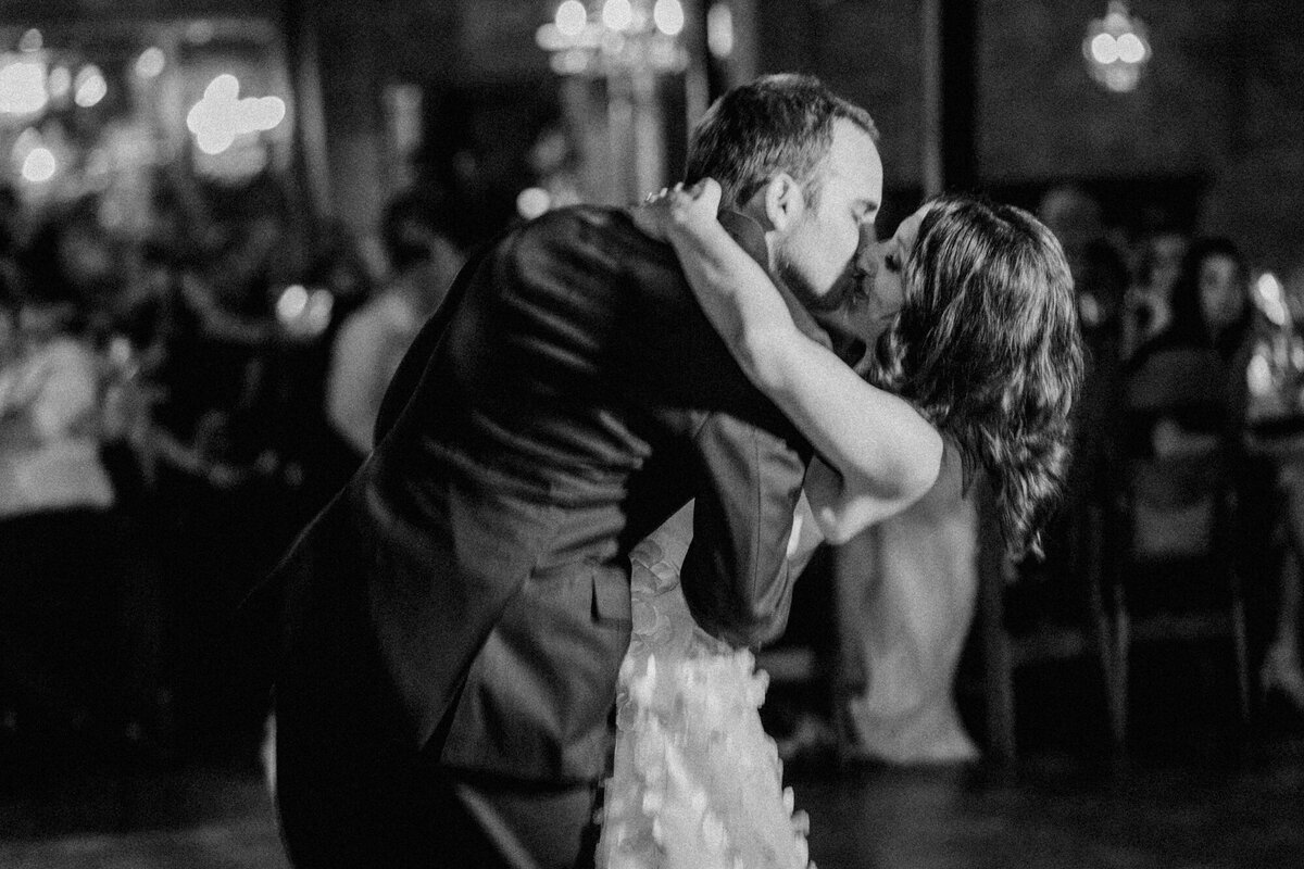 A grainy film like black and white photo of a first dance at Salvage One in Chicago