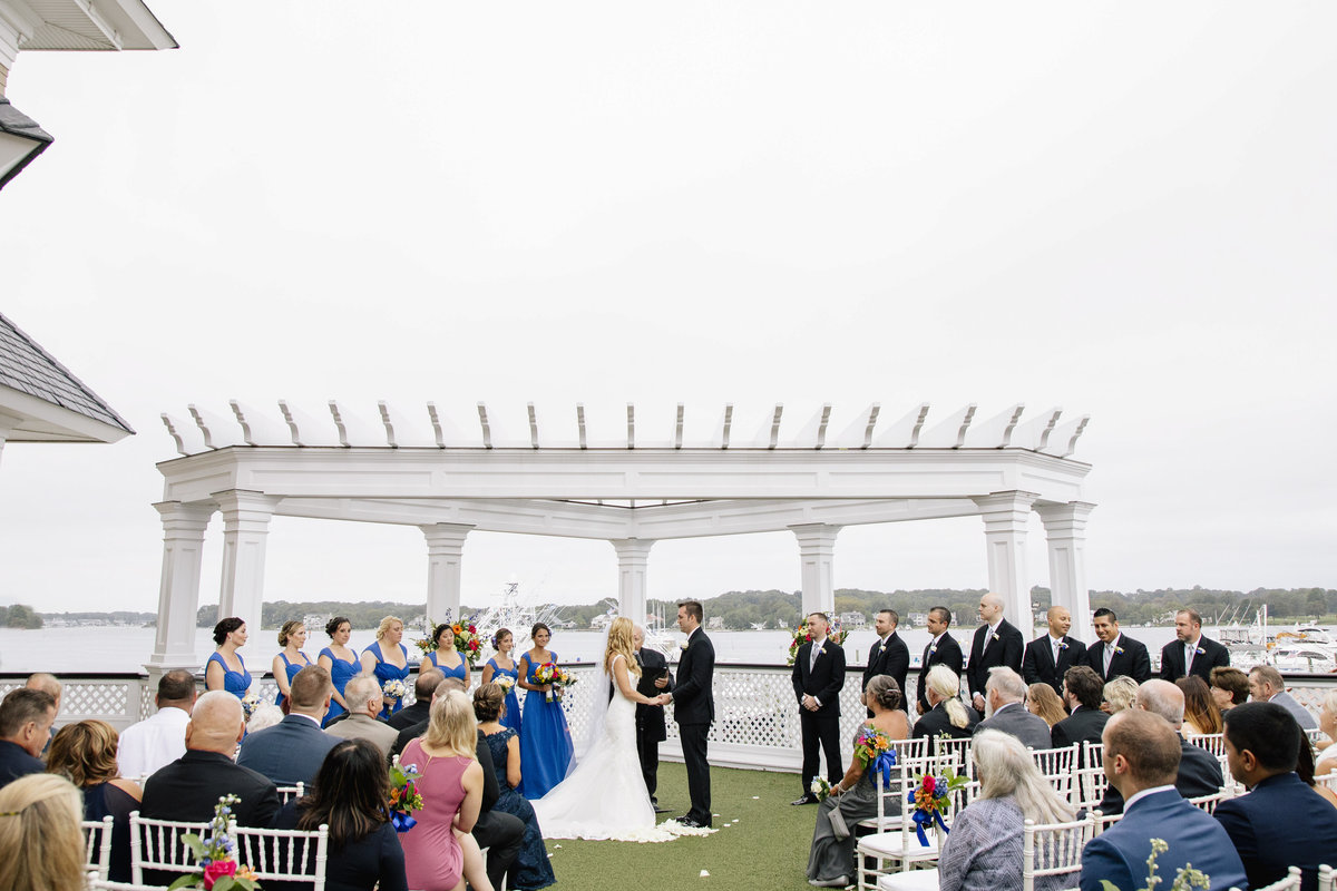 bride and groom getting married at clarks landing yacht club wedding
