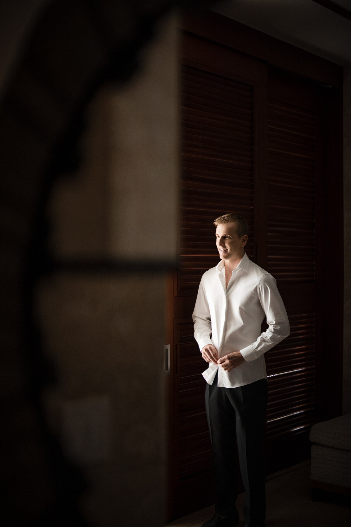 A groom gets ready  at a destination wedding in Puerto Rico