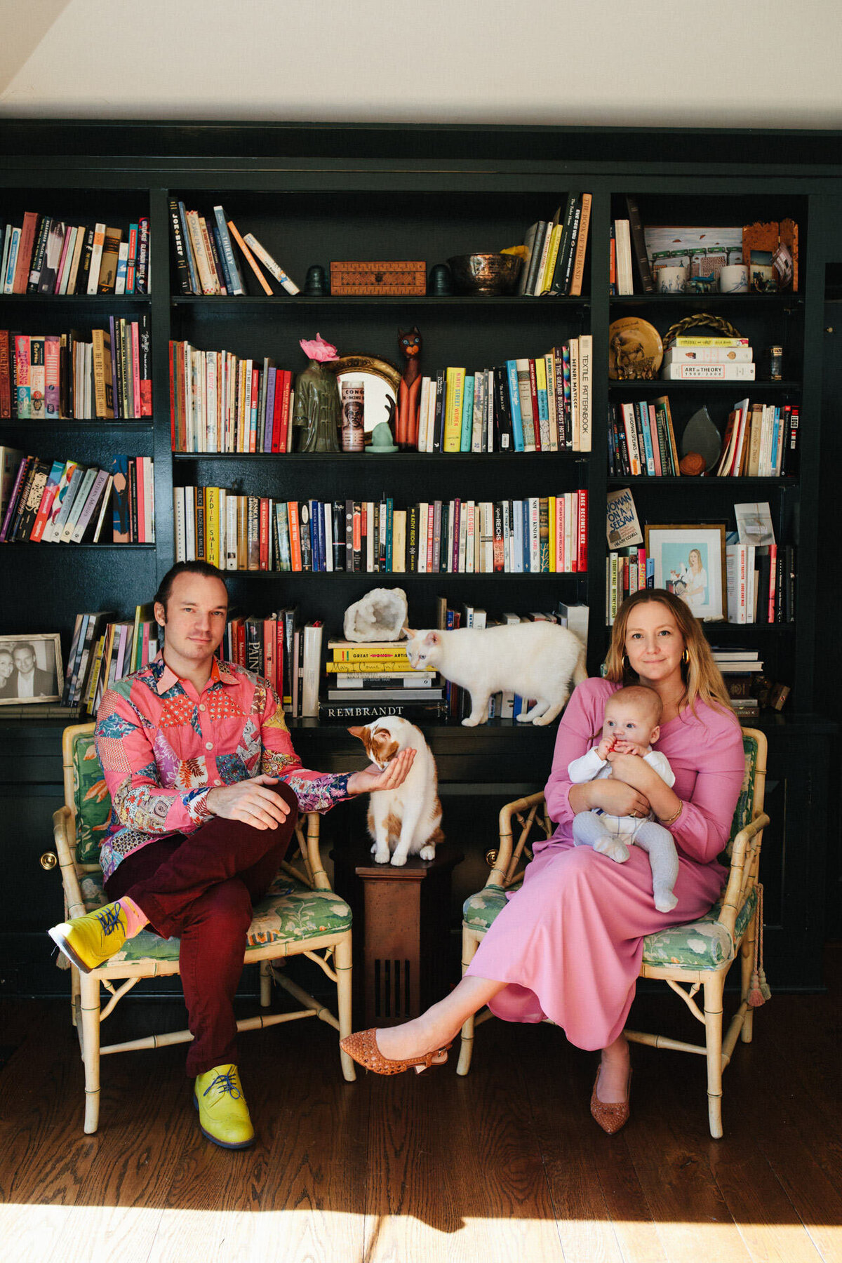 nyc family portrait with two cats a baby and pink dress