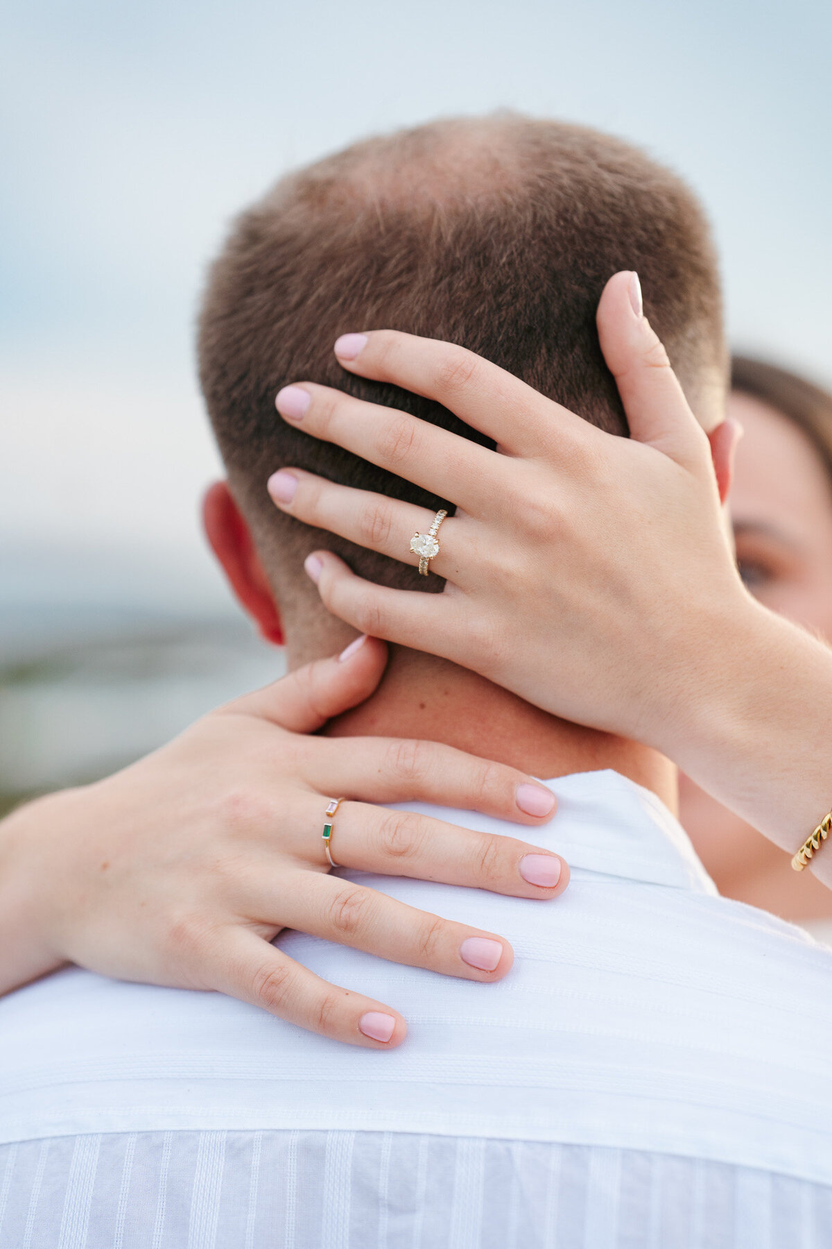 Romantic coastal engagement session in New England overlooking the shoreline.