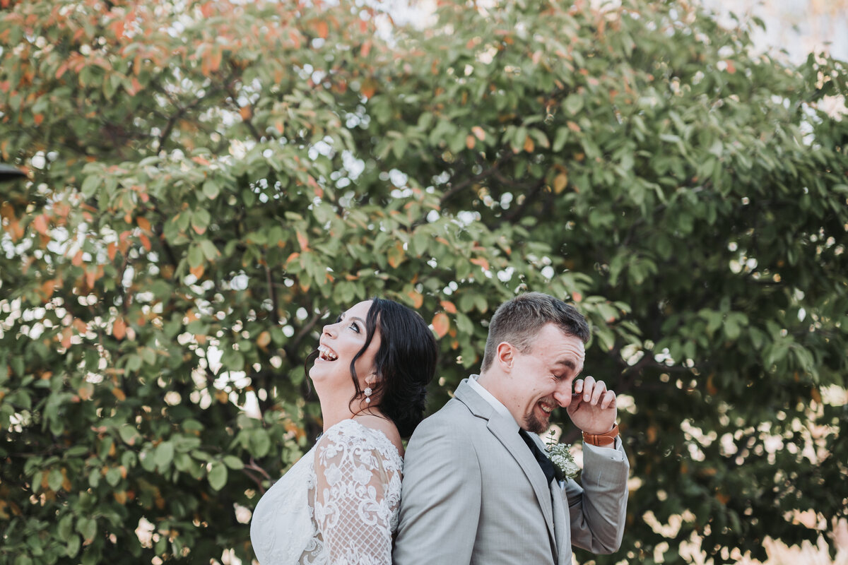 Couple laughing and crying as they read their vows to each other in South Dakota.