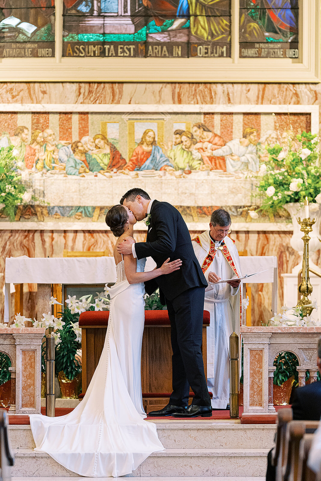 assumption-bride-and-groom-first-kiss-ceremony