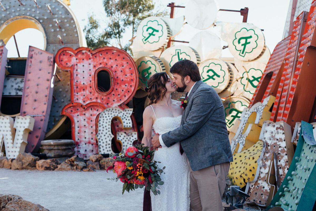 couple kissing at the Neon Museum