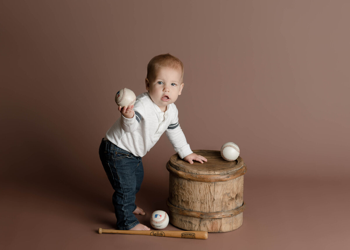 One Year Old Holding Baseball