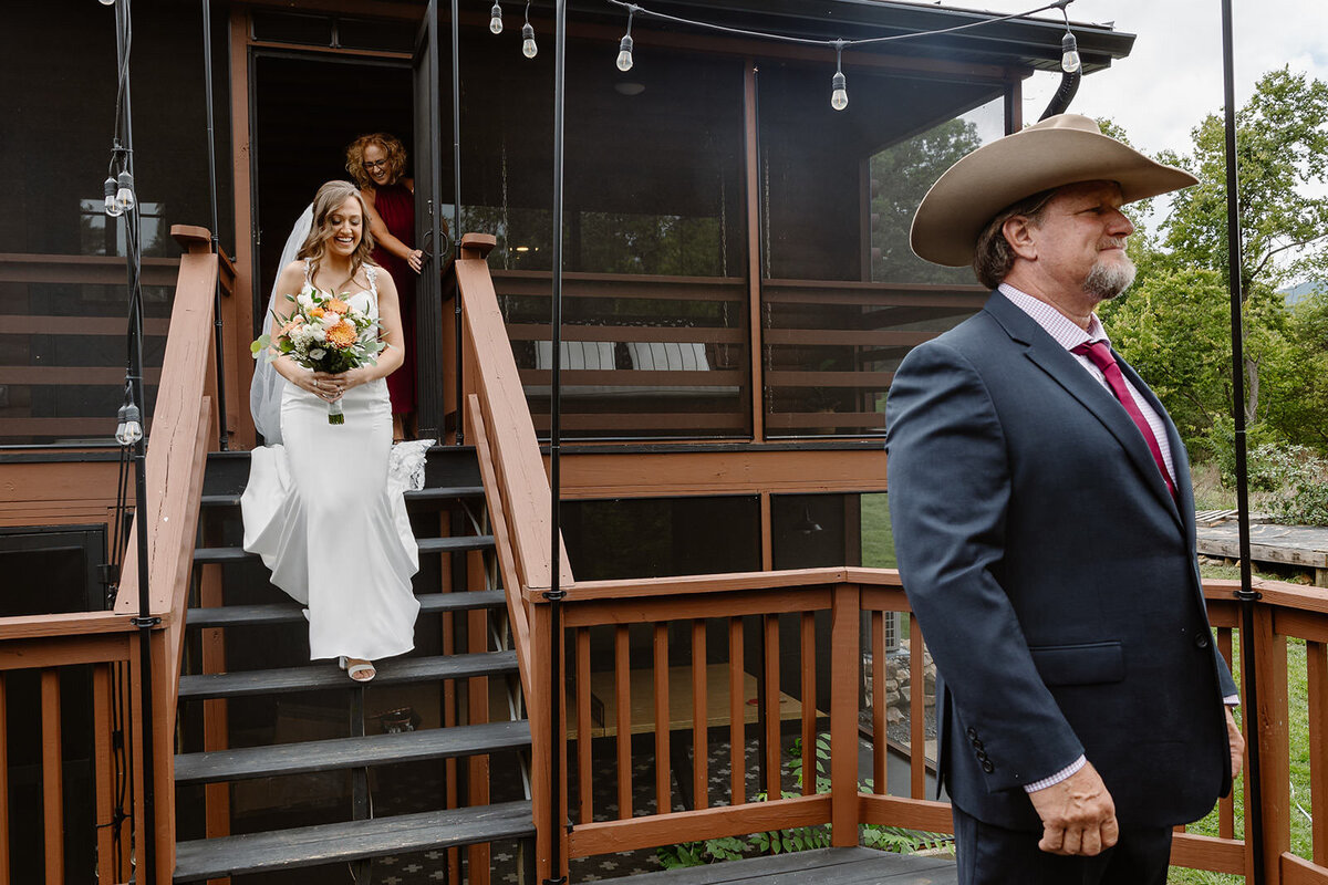 A person walking down a staircase for a first look