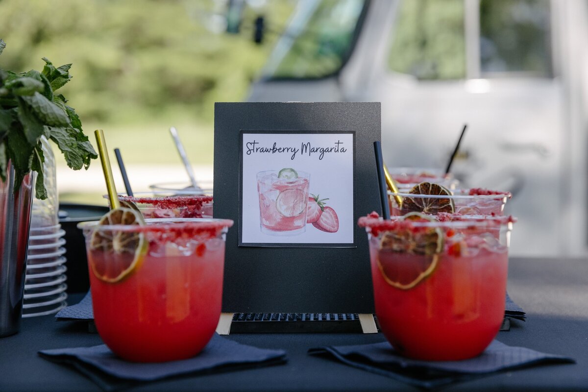 Bee Tapped Dry Bar beverage truck with red cocktails served at outdoor party