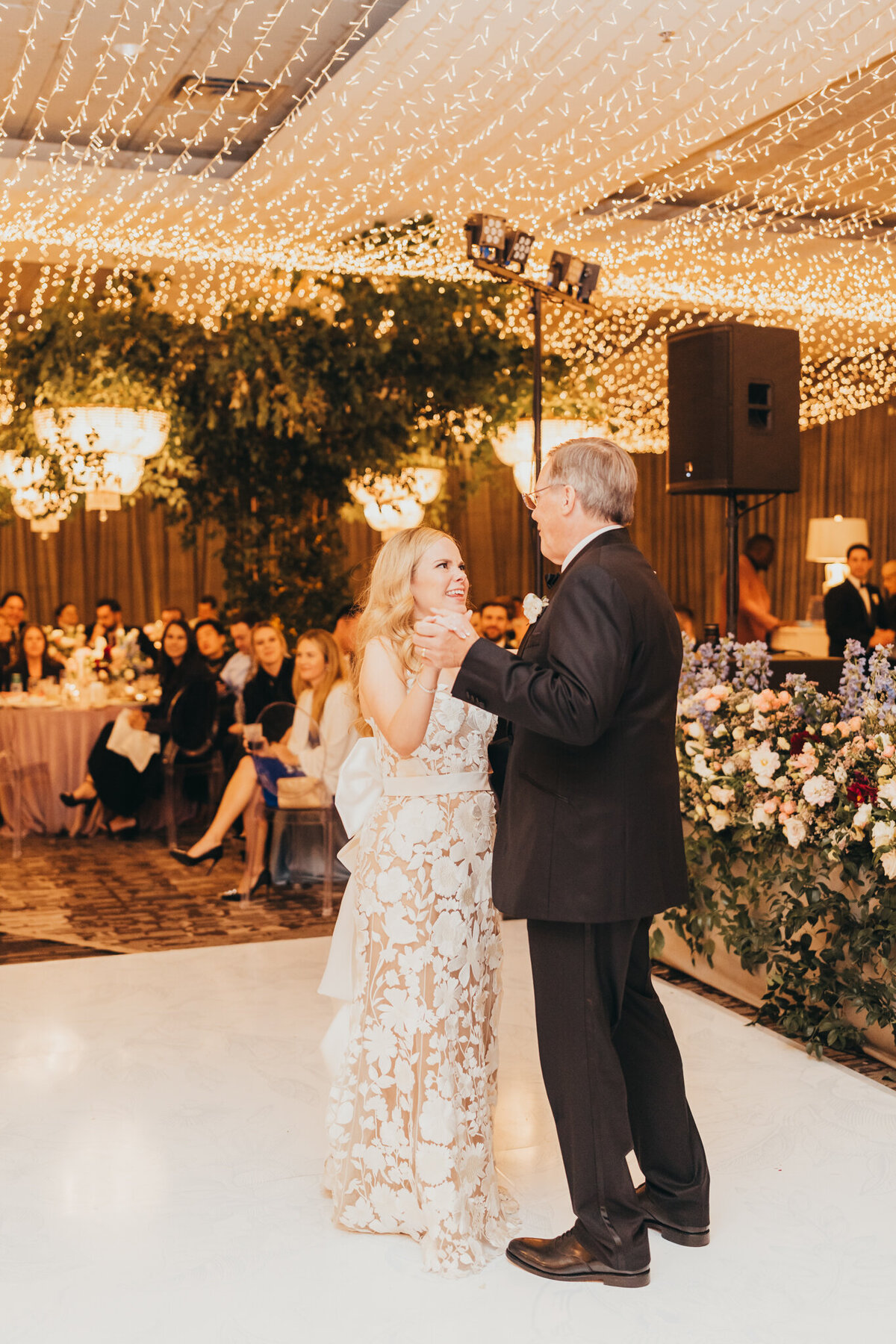 bride has her first dance with dad  at her wedding reception