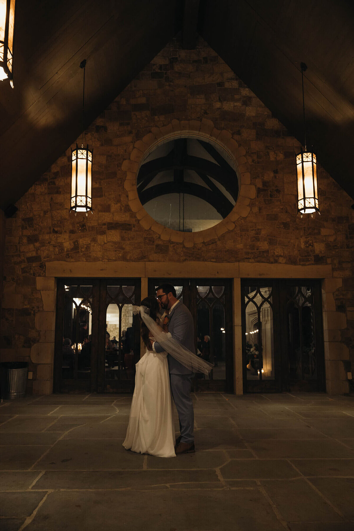 A bride and groom have their first dance outdoors at the chateau De Lis wedding venue in Oregon.