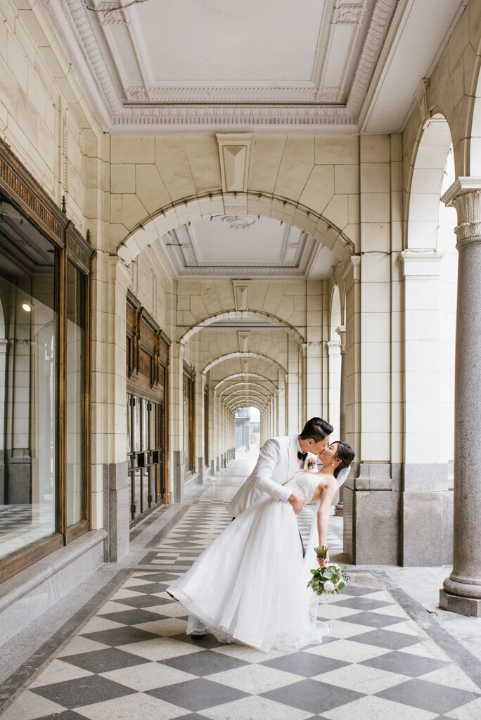 Bride and groom kissing at Hudson in downtown Calgary. Captured by M2S Photography, timeless and elegant wedding photographer in Calgary, Alberta. Featured on the Bronte Bride Vendor Guide.