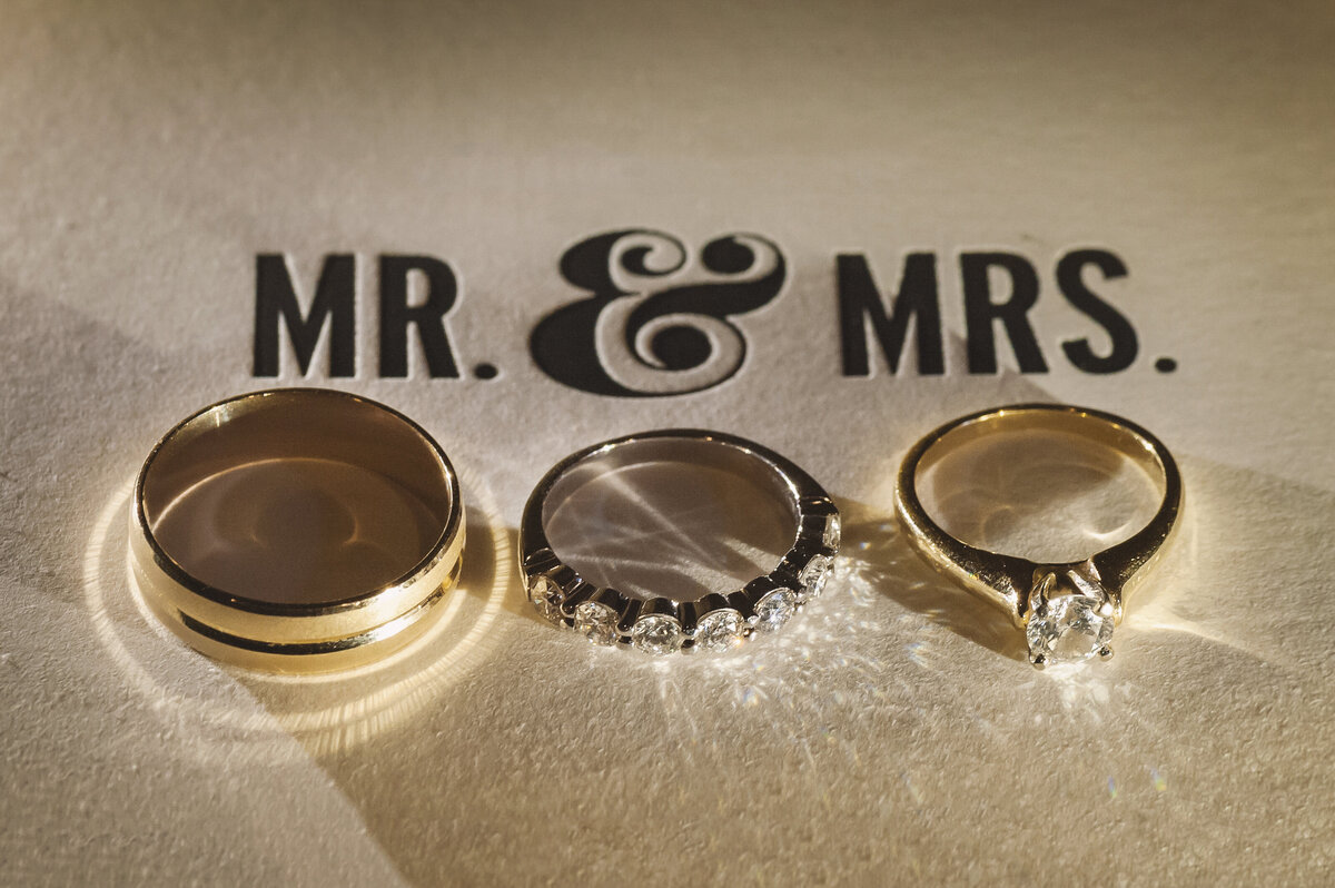Gold wedding rings with words Mr. & Mrs.