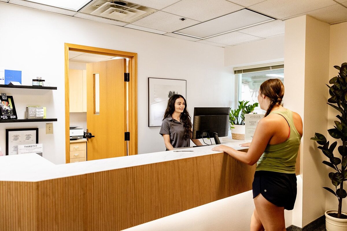 Person checking into their first integrative PT session at Embody Health & Performance