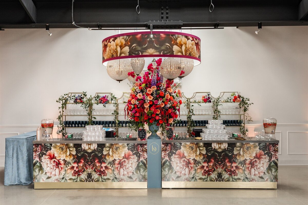 Event space styled with a Baroque theme, featuring ornate gold accents, rich fabrics, grand chandeliers, and intricate moldings, creating a luxurious and dramatic atmosphere