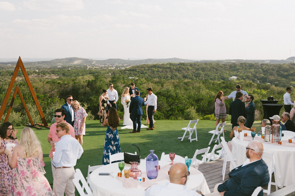 wedding guests hanging out during reception 