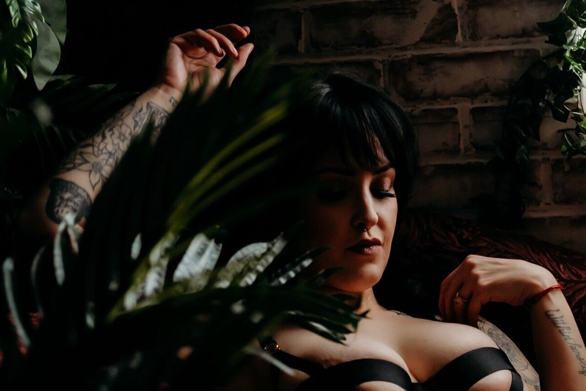 Boudoir photography woman in black lingerie leaning against wall Lubbock, Texas Boudoir photographer in Amarillo TX