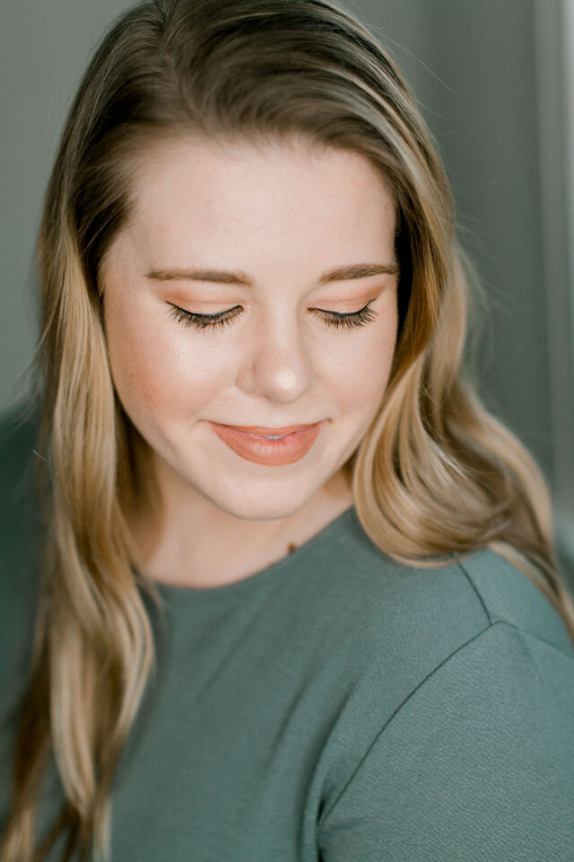 personal branding image of woman  looking down