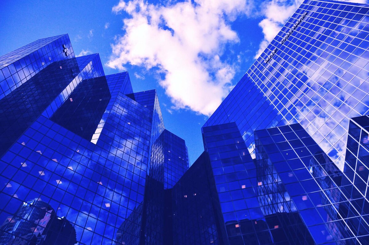 Photograph by Florine Vita on Unsplash. Skyscrapers at an angle.
