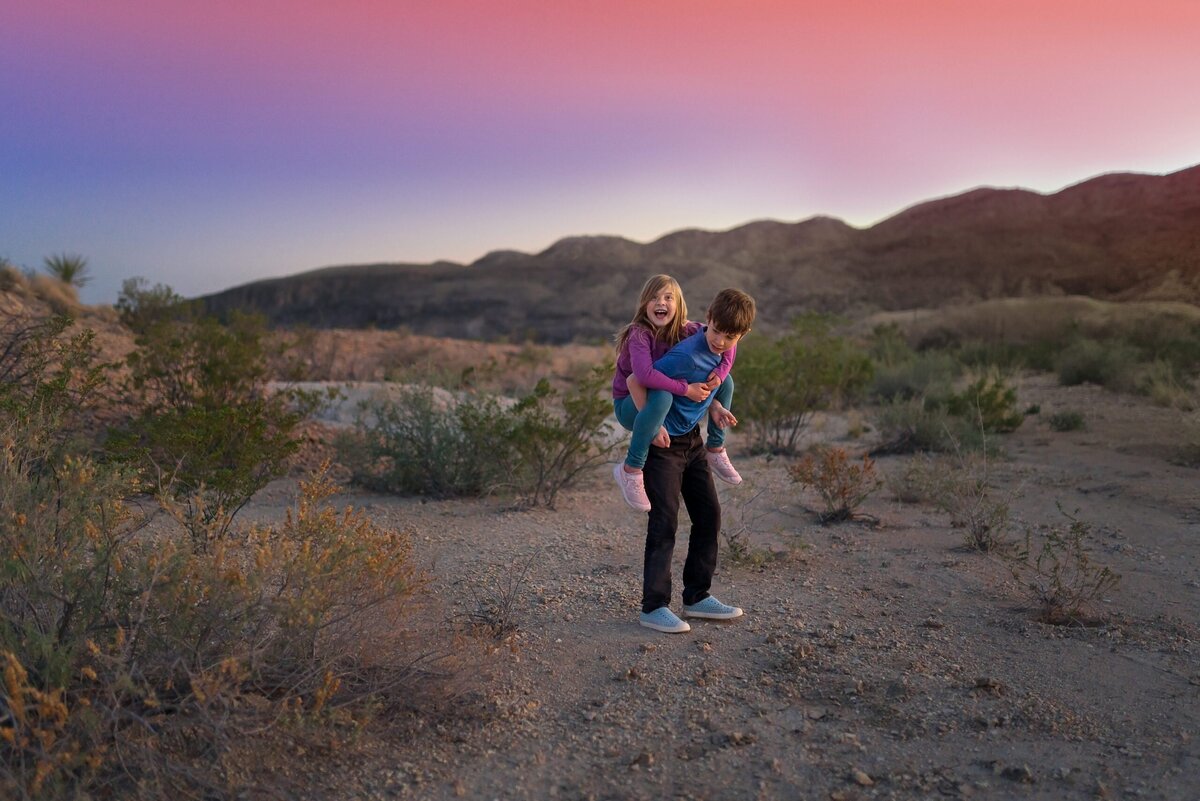 Two children play in the dessert at Big Bend National Park.