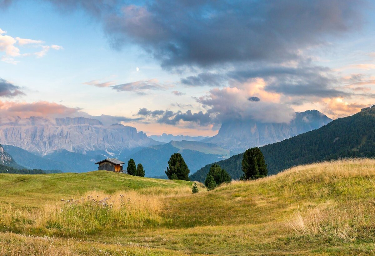 Photograph of a wide view looking down across a Jeep trail and many mountains near Telluride, Colorado.