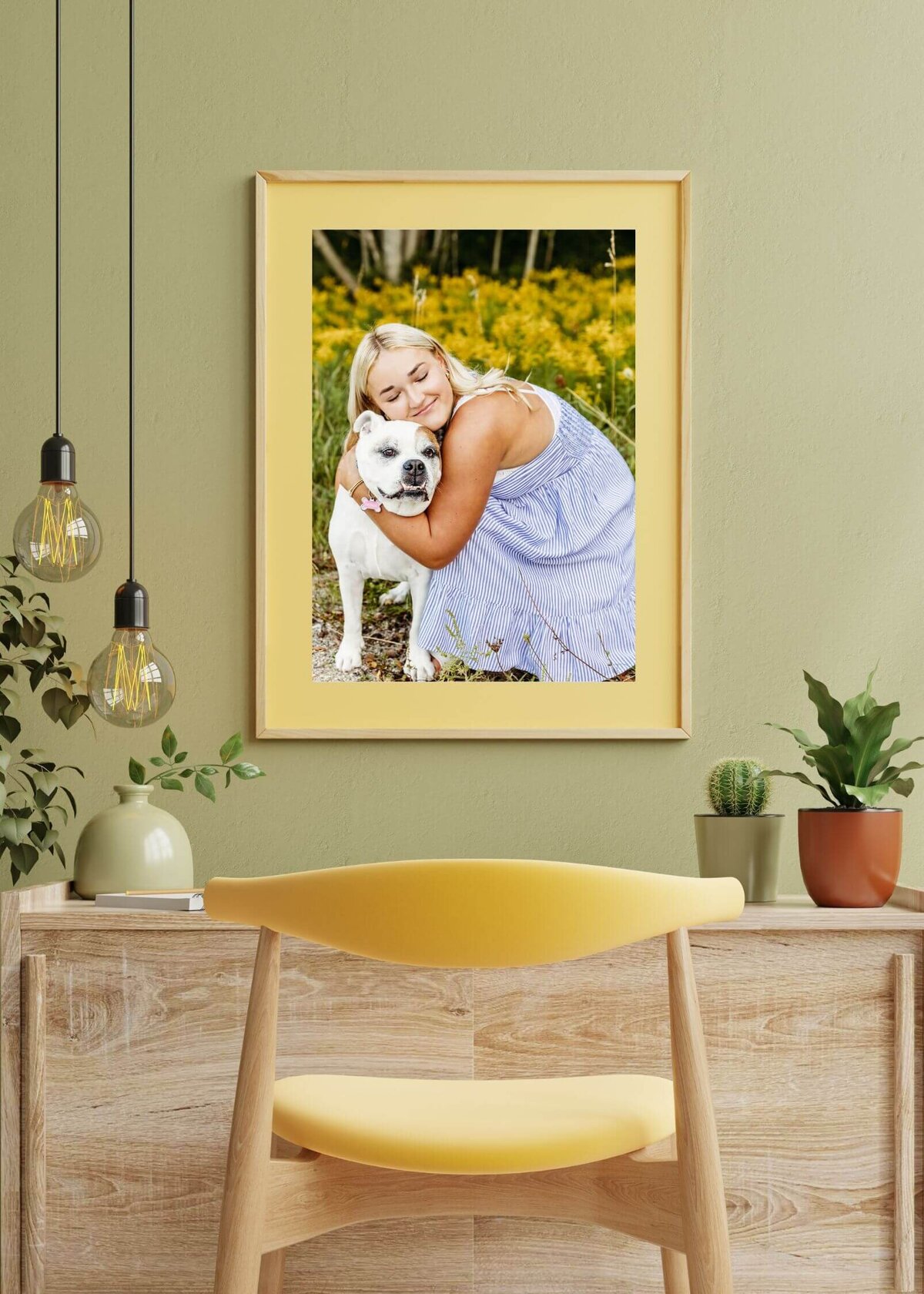 photo of an office with a teen girl hugging her dog photo hung up on the wall above the desk