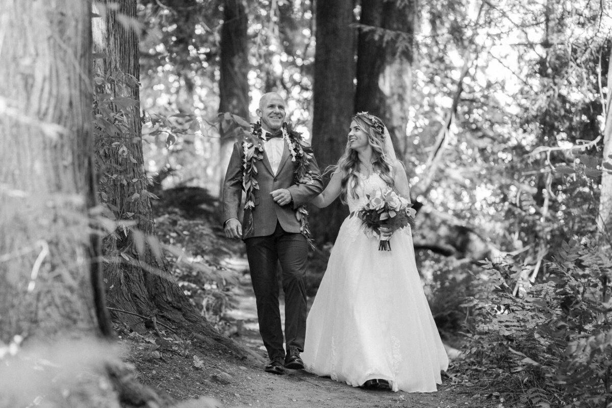 Father-of-bride-walks-her-daughter-down-the-aisle-at-fairytale-woodland-wedding-in-Snohomish-WA-at-Twin-Willow-Gardens-wedding-venue-photo-by-Joanna-Monger-Photography