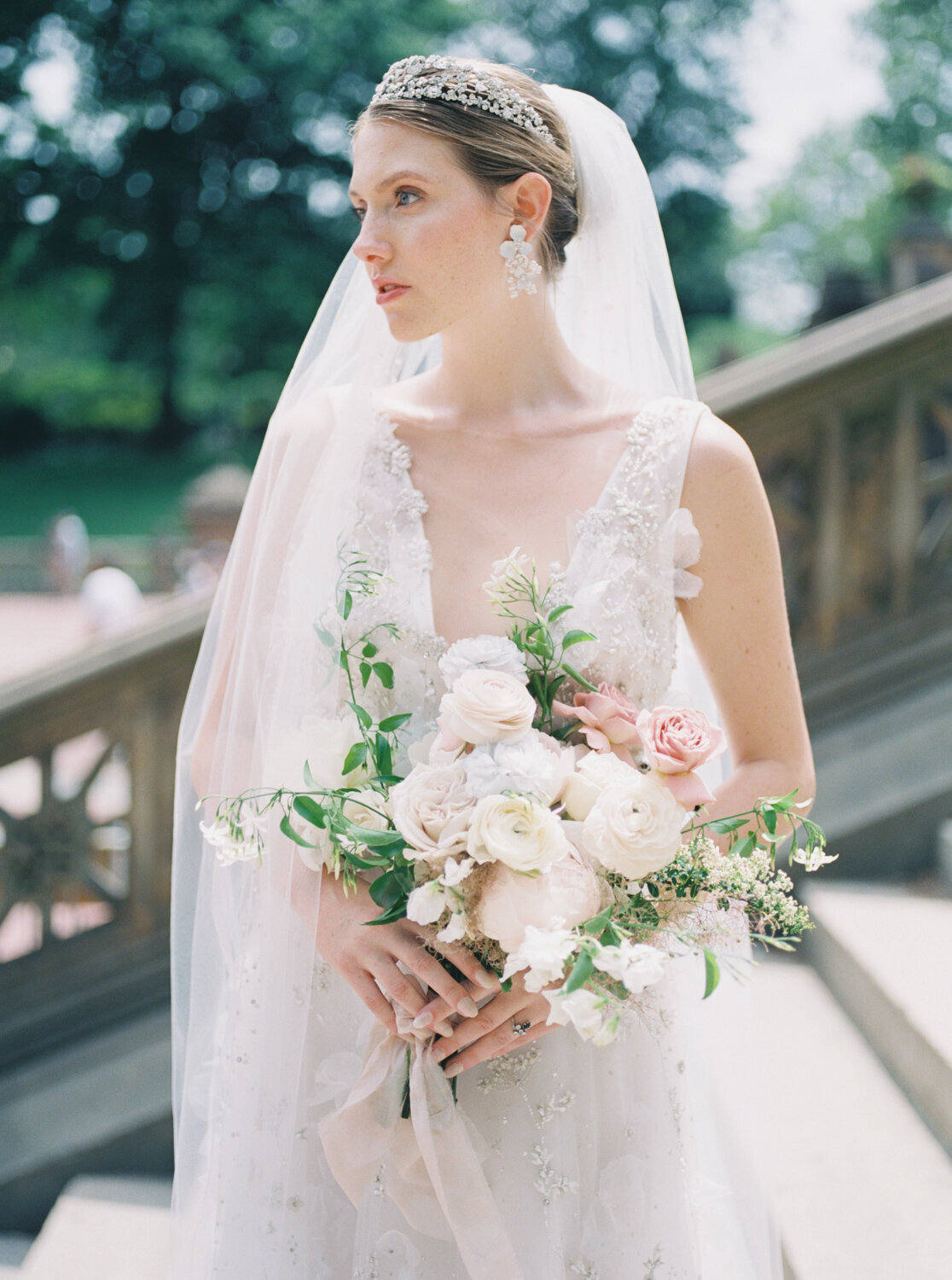bride holding bouquet in the sun