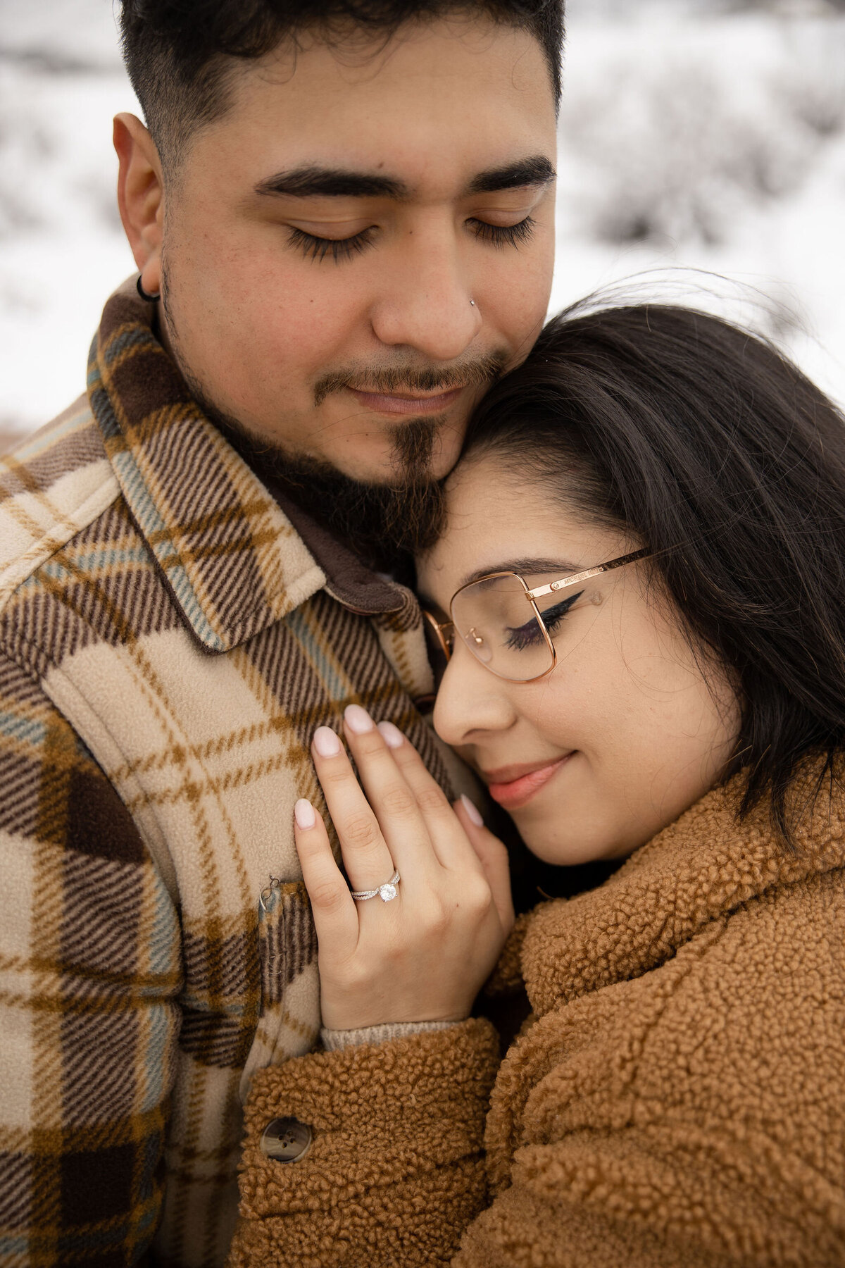 Cute couple snuggles during denver photoshoot