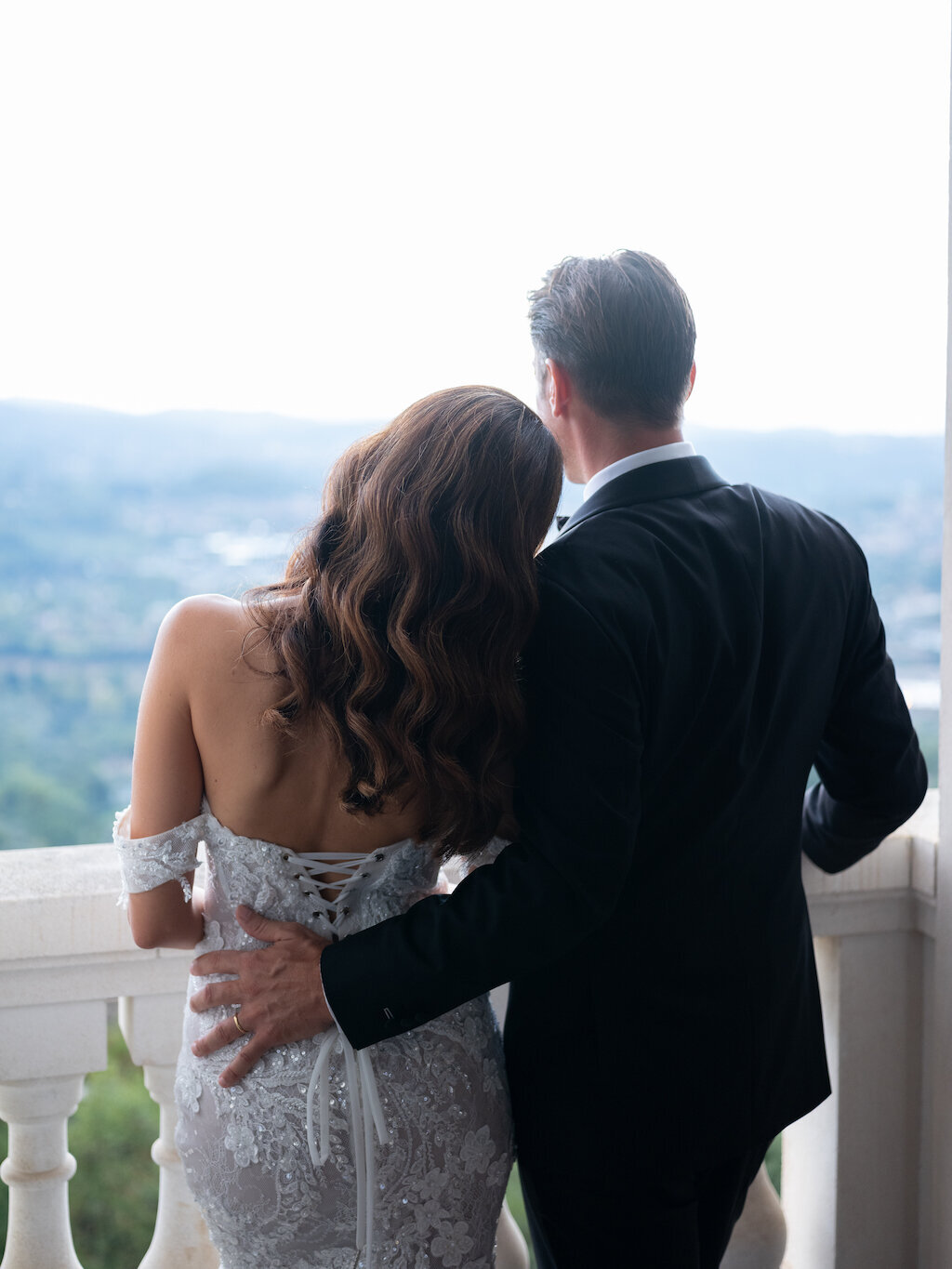 Sarah and Jeremy wedding photography at Chateau Saint Georges on a balcony