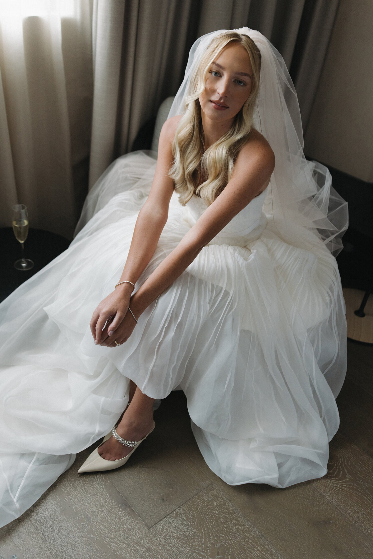 Sophisticated editorial wedding photography at NOBU Hotel Chicago featuring Lauren Alatriste's fashion forward approach, creating luxury wedding imagery that balances magazine-worthy editorial excellence with authentic bridal preparation
  moments.