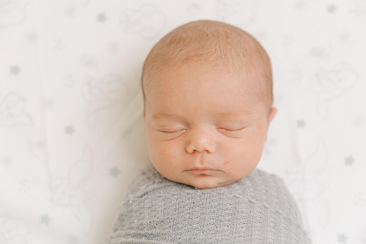 Newborn baby boy sleeping during his session with molly berry photography