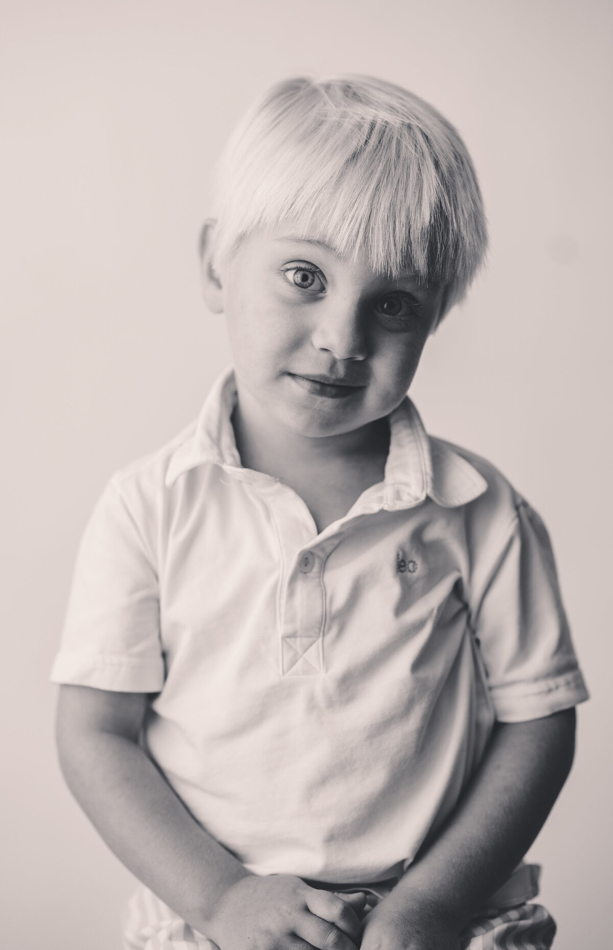 Young boy peers into the camera during Personality Portraits in Charleston, South Carolina.