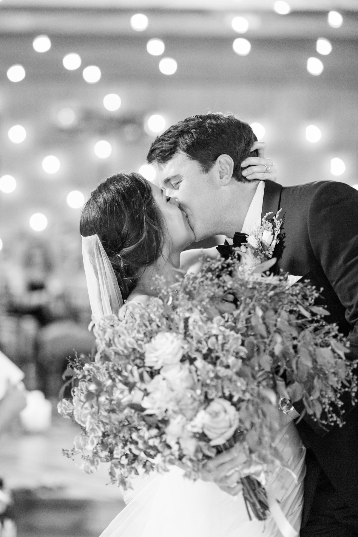 bride and groom kissing after ceremony