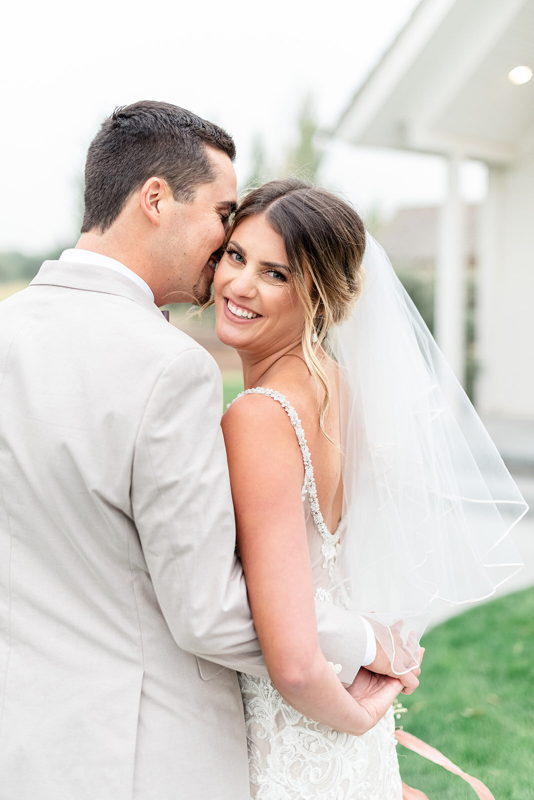 Bride and groom posing for Light and airy wedding photography by the Best Boise Wedding Photographers