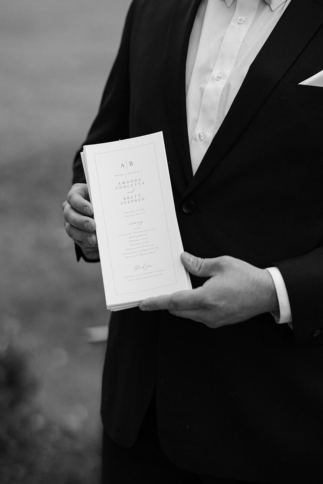 Guest holding wedding program