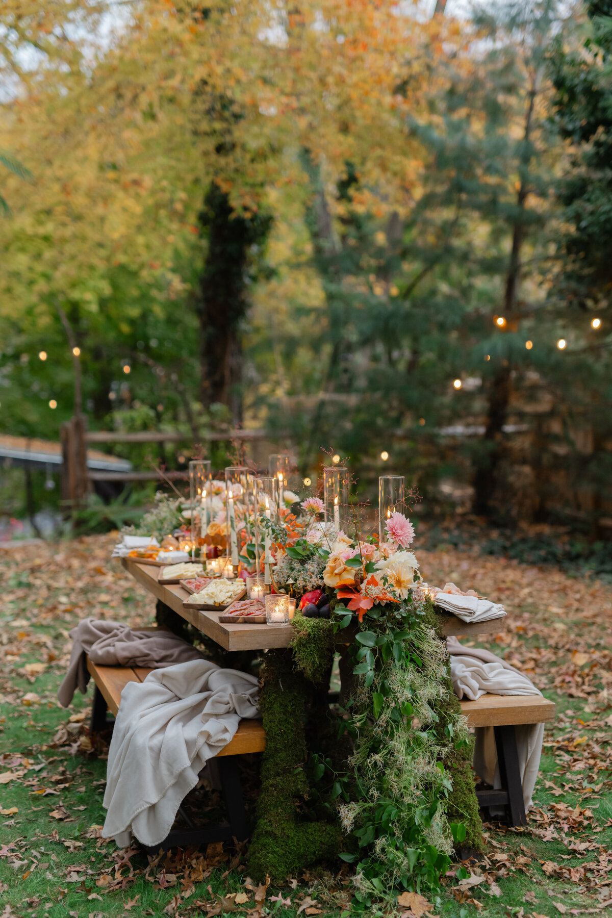 Harvest inspired tablescape with flower arrangement and candles