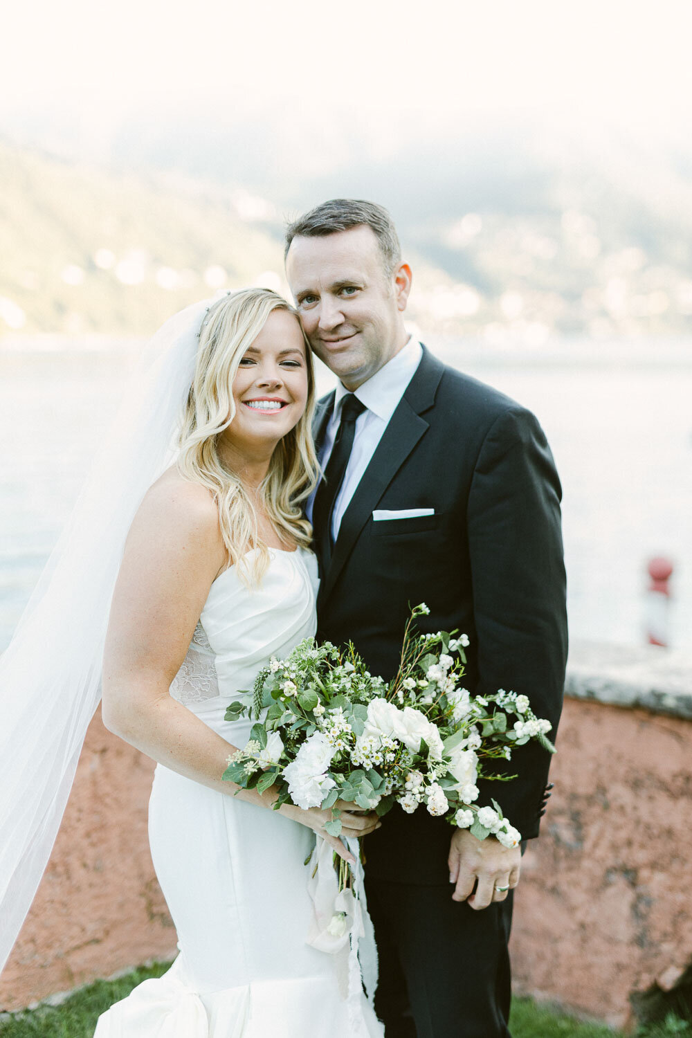 close up portrait of bride and groom at lake como