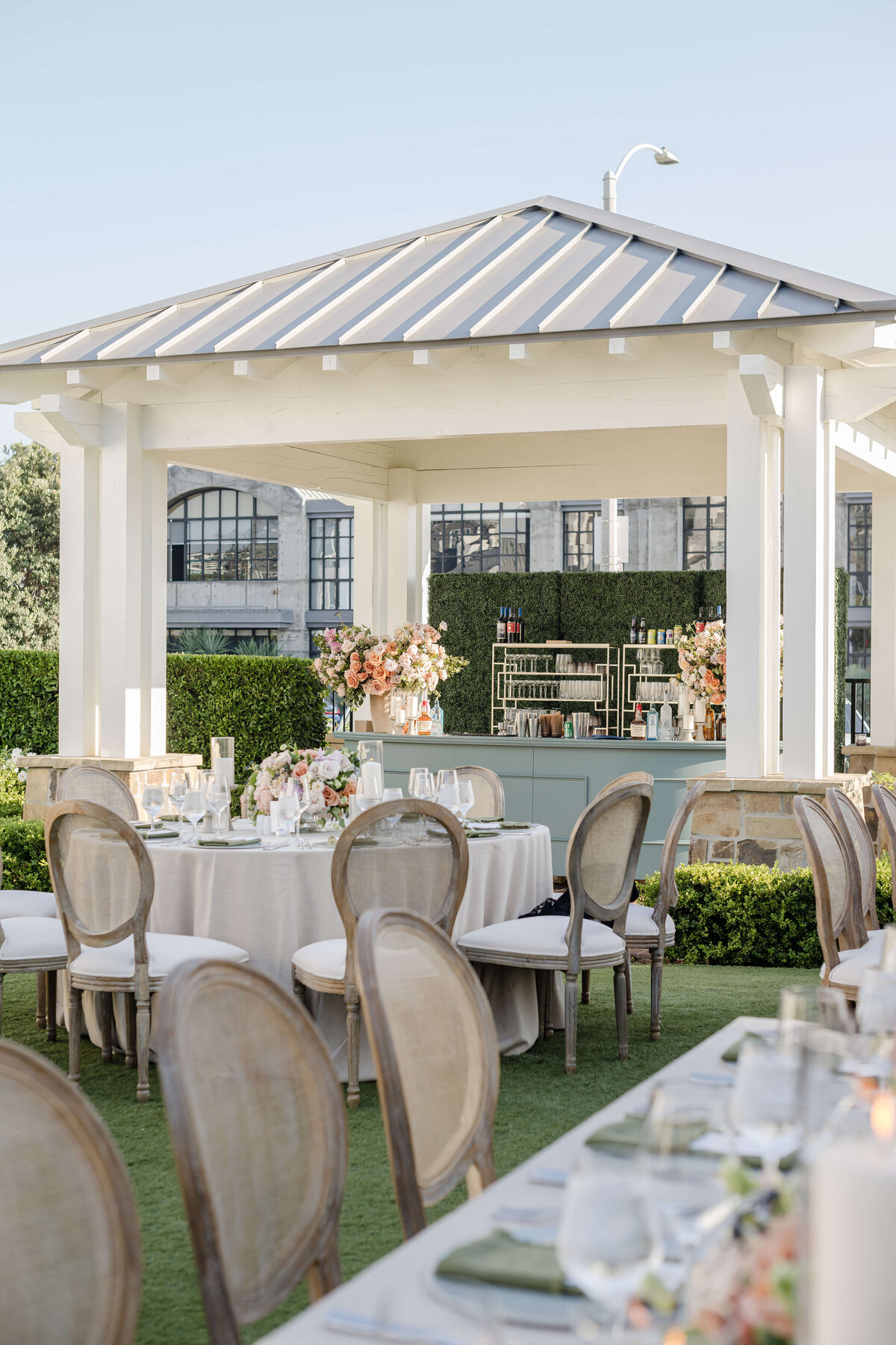 Outdoor tented wedding in Malibu, with a custom bar and luxury details
