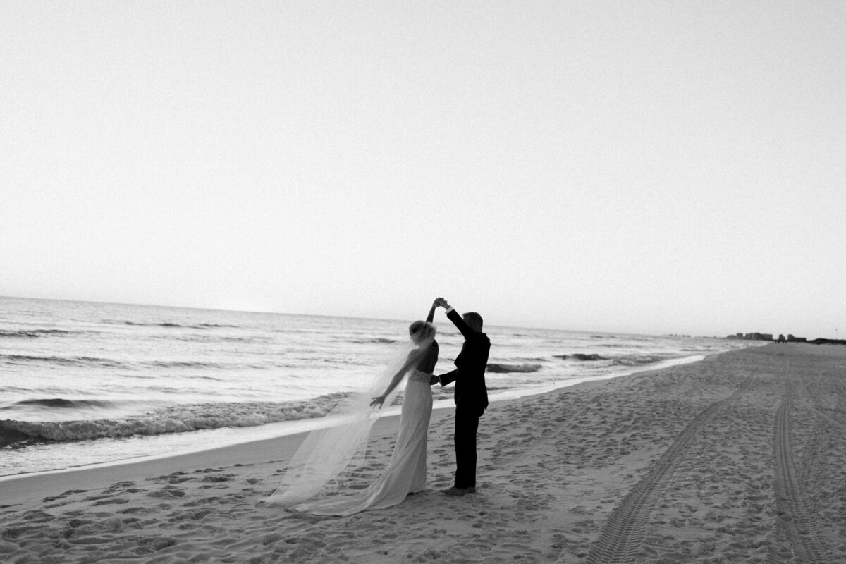 A bride and groom dancing on the beach at their wedding on 30A Rosemary Beach Florida