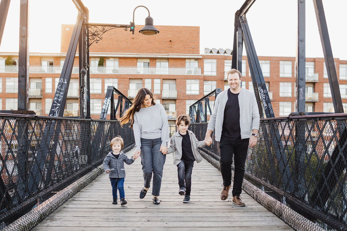 family of 4 walking on wallace bridge in toronto