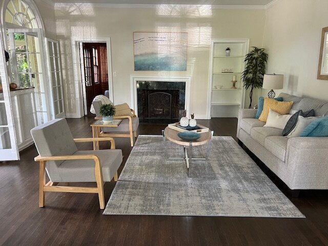 living room with grey chairs and sofa