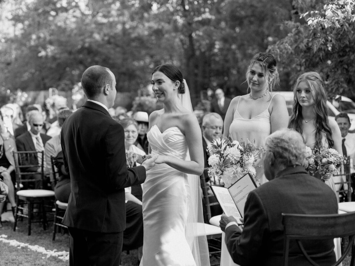 Outdoor wedding ceremony under clear blue sky.