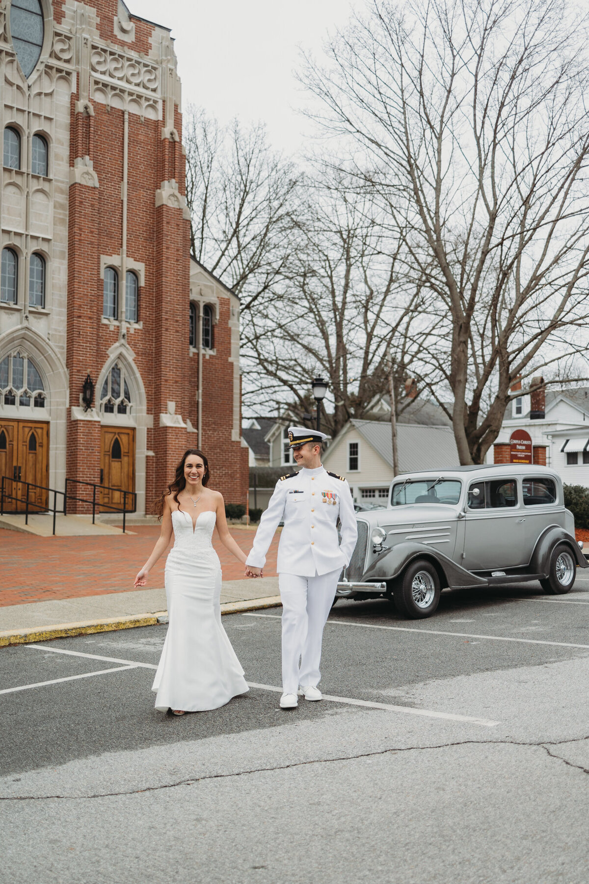 bride and groom holding hands