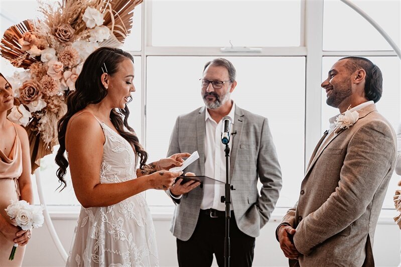 Experience the heartfelt exchange of wedding vows as Tamara pledges her love to Matthew. Join in their special moment filled with love, commitment, and promises for a lifetime.