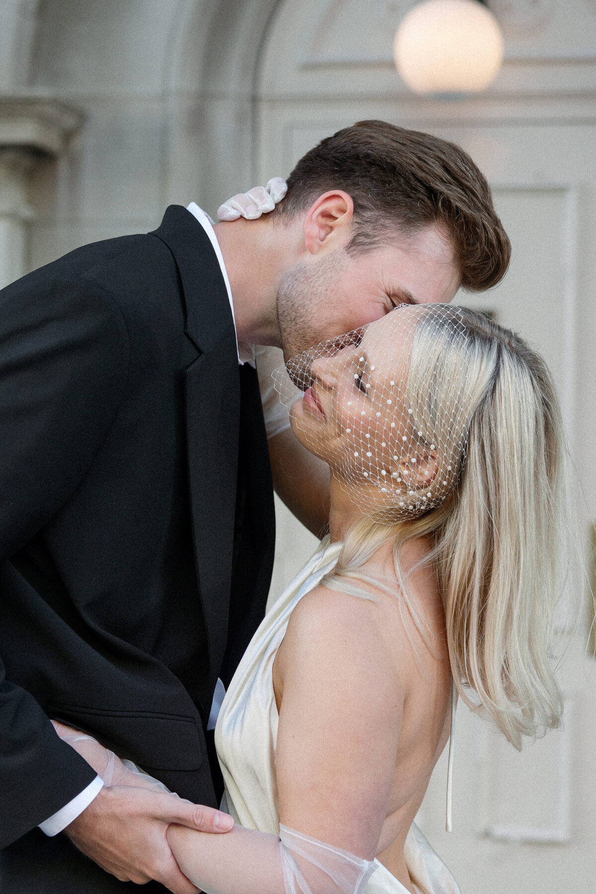 Charming bride and groom portraits taken in downtown Madison, highlighting the couple's love against the backdrop of the city's iconic streets and scenic views.