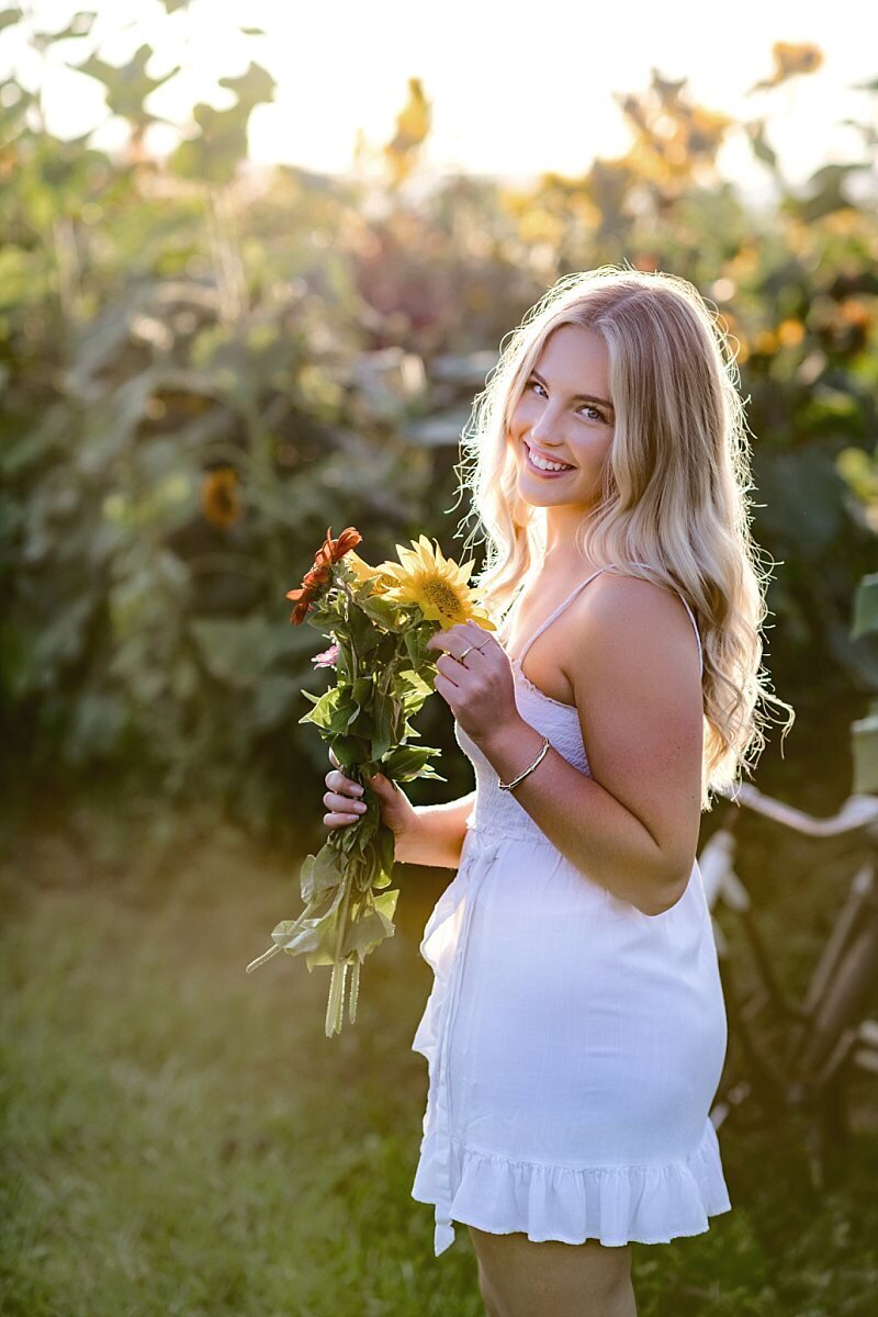 Teen-girl-smiling-holding-flowers