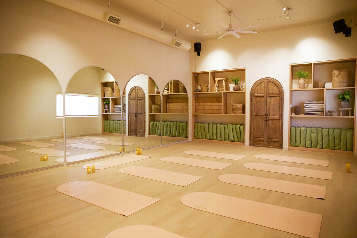 Interior of beautiful boho yoga studio in San Diego, California.