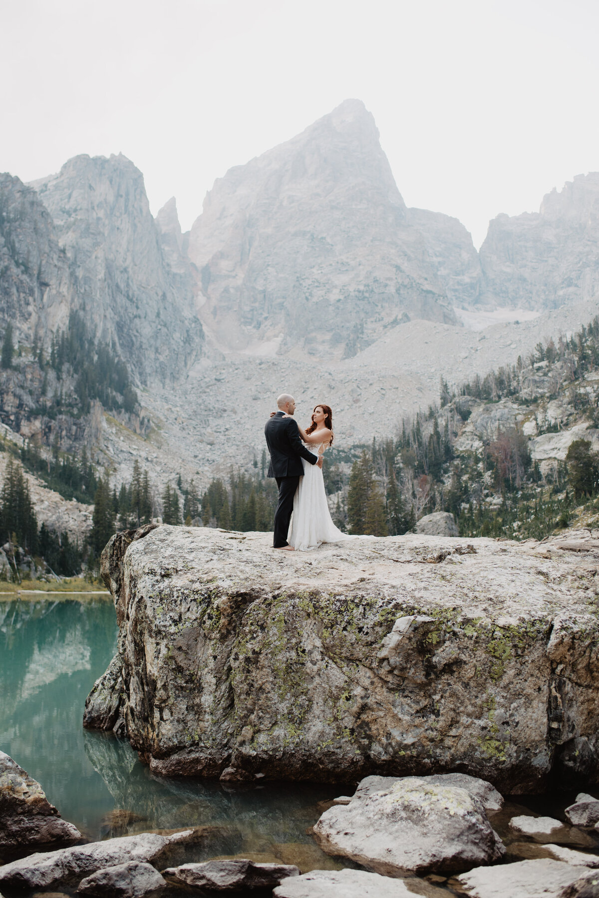 Jackson Hole photographers capture bride and groom laughing together