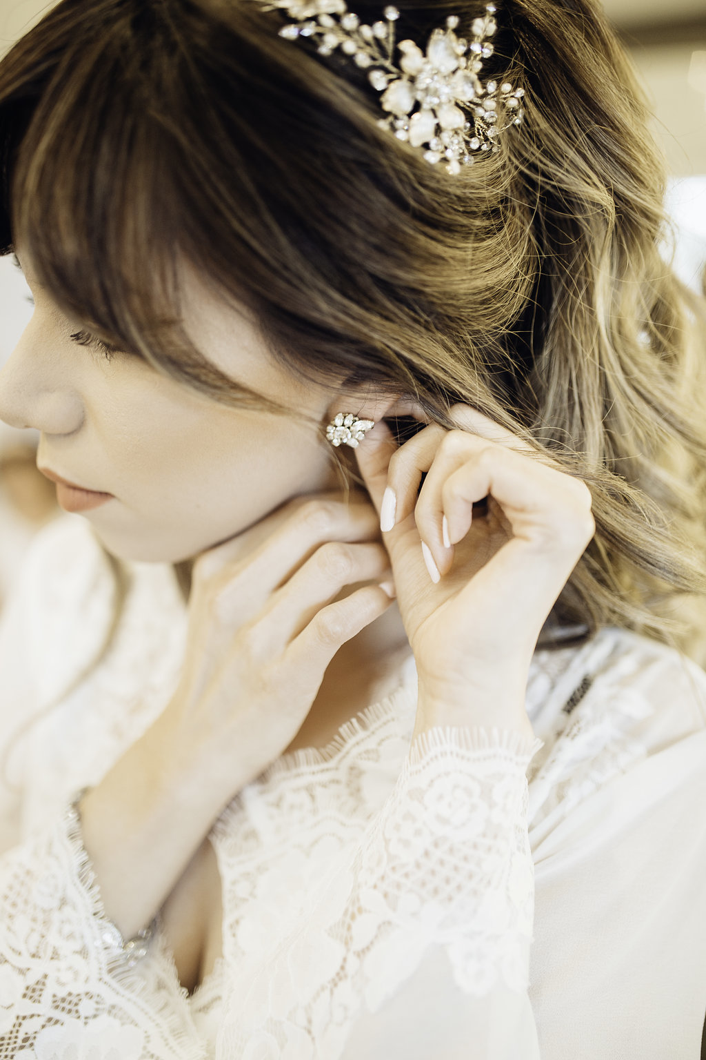 Wedding Photograph Of Woman Fixing Her Earrings Los Angeles
