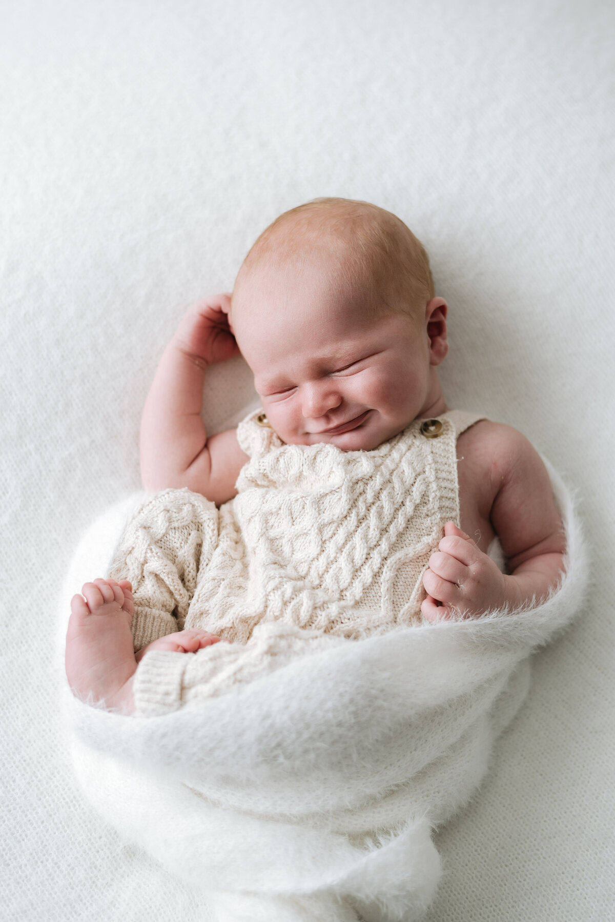 baby boy smiling at billingshurst newborn photoshoot